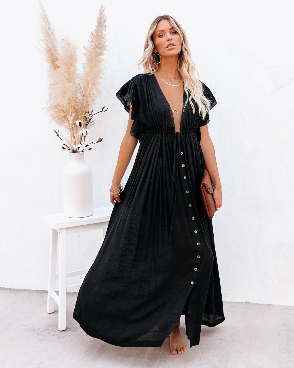Women's boho beach cover-up with wrap V-neck and flowing design, perfect for summer resort wear.