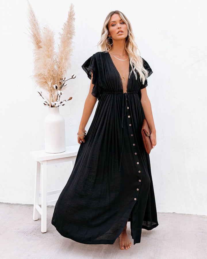 Women's boho beach cover-up with wrap V-neck and flowing design, perfect for summer resort wear.