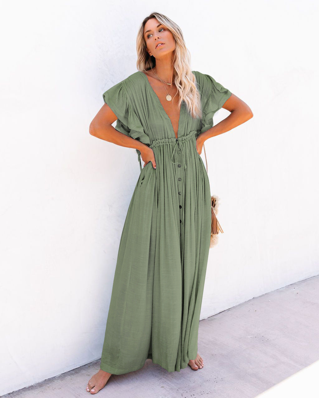 Elegant women's boho beach cover-up featuring a wrap V-neck and flowing silhouette. Great for beach or pool.