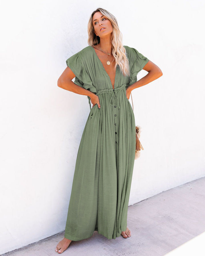 Elegant women's boho beach cover-up featuring a wrap V-neck and flowing silhouette. Great for beach or pool.