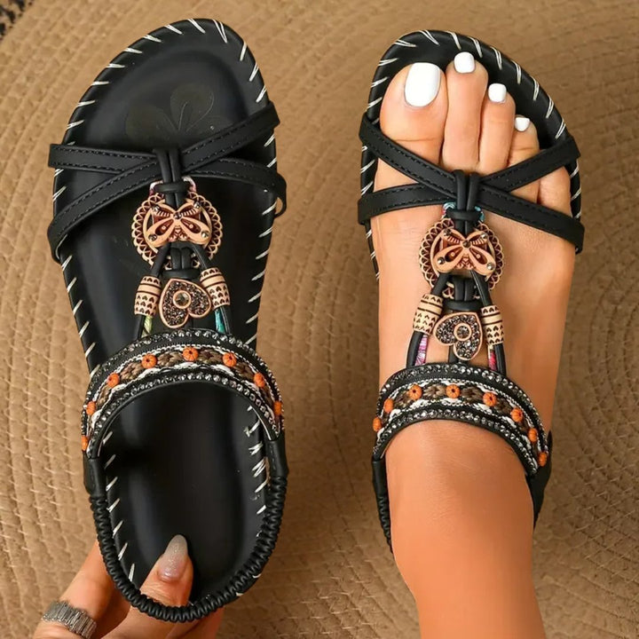 Beaded t-strap flat sandals for women, orthopedic arch support, elastic strap for comfortable summer wear.