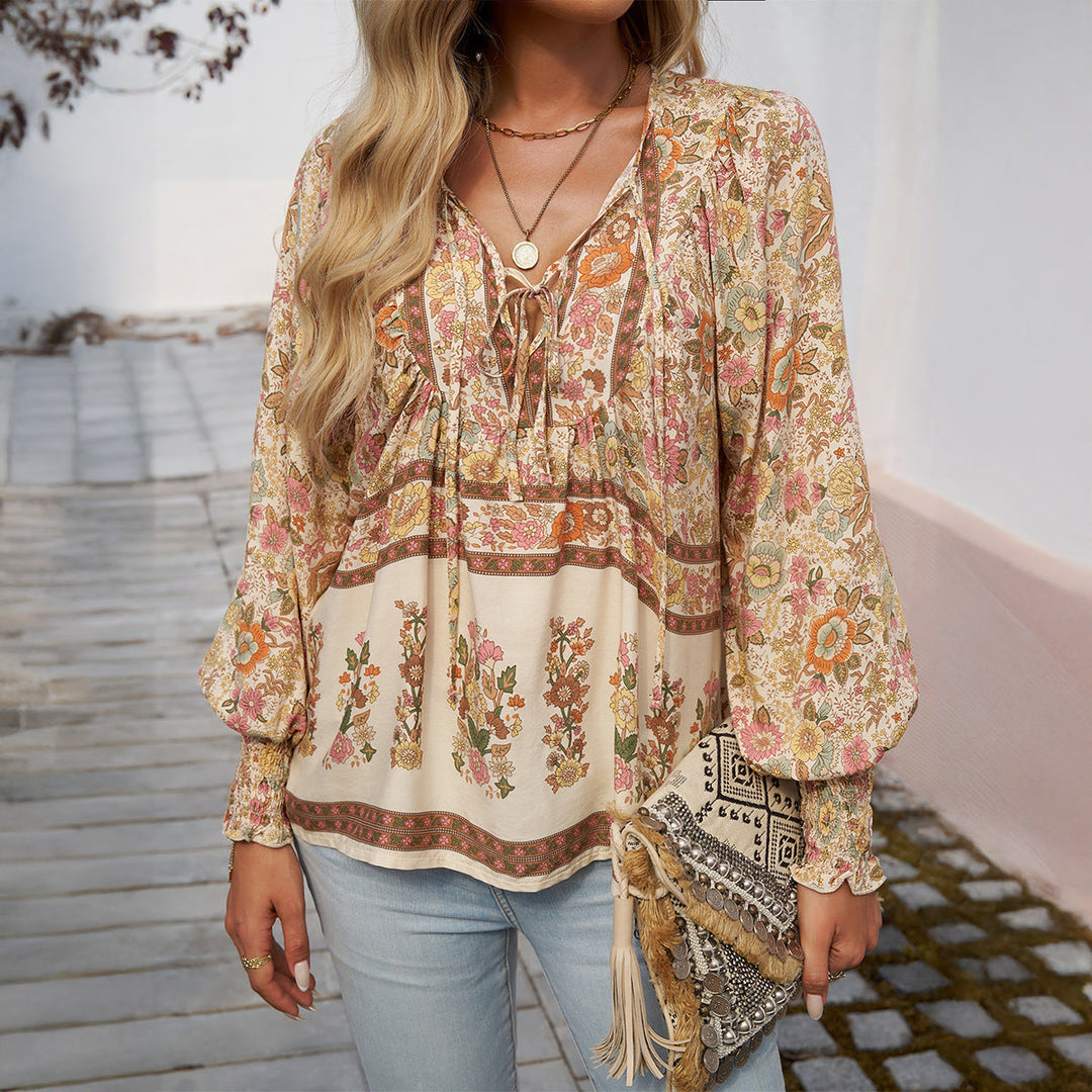 Relaxed fit women's floral printed blouse, boho style, with comfortable loose design and puff sleeves.