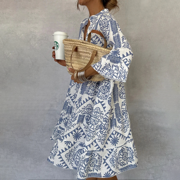 Women's boho floral print swing dress with V-neck, 3/4 sleeves. Perfect casual midi for summer & beach resort wear.