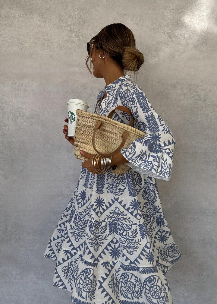 Stylish women's V-neck boho print midi dress featuring 3/4 sleeves and a flowy a-line skirt, ideal for summer.