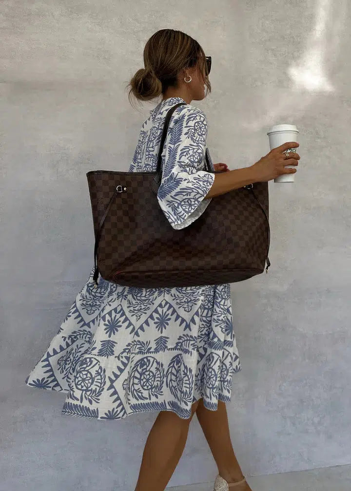 Full view of a women's boho floral print V-neck swing midi dress, ideal for summer, casual outings & resort.