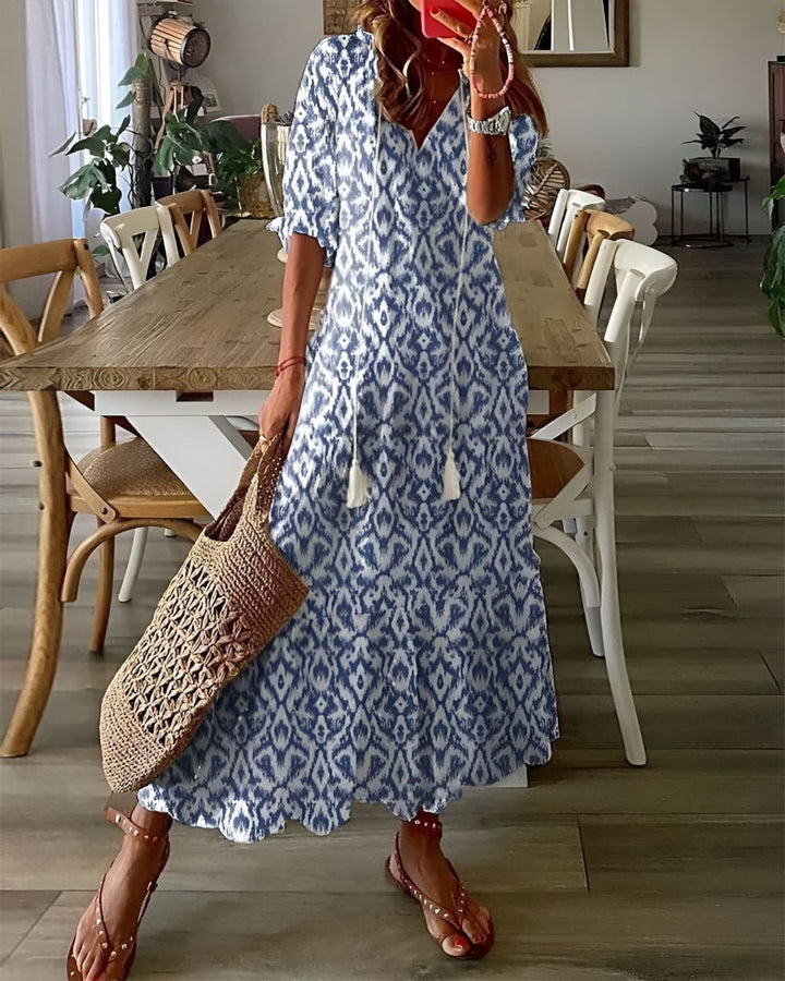 Women's boho flowy maxi dress with adjustable straps. Perfect for summer, beach, or casual wear.