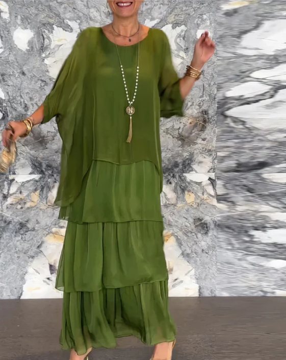 Women's two-piece boho maxi dress set for vacation: a flowy batwing top & a tiered skirt. Perfect summer style.