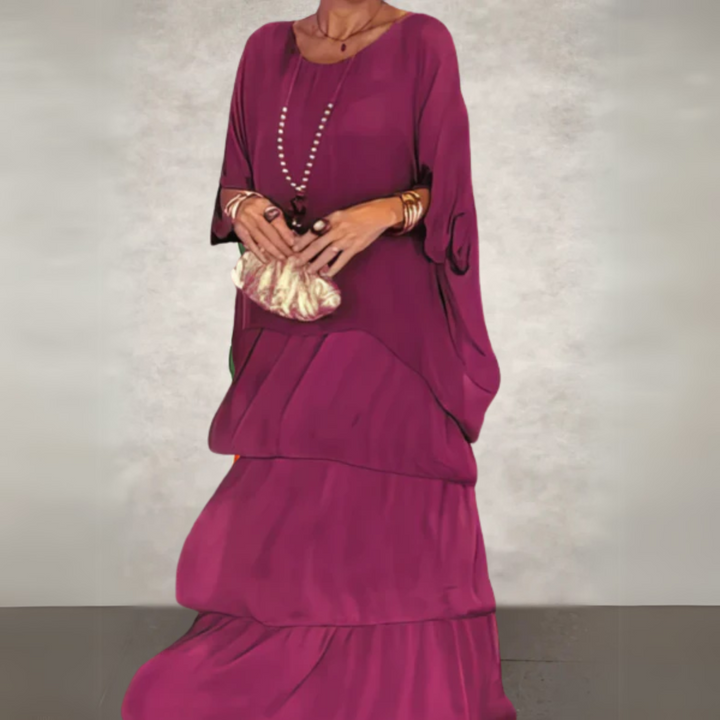Plus size boho maxi dress set, a layered women's outfit with flowy batwing top and a chic tiered skirt.
