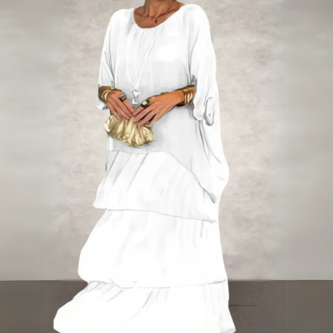 Boho two-piece set: a women's flowy batwing top paired with a matching tiered maxi skirt for summer.