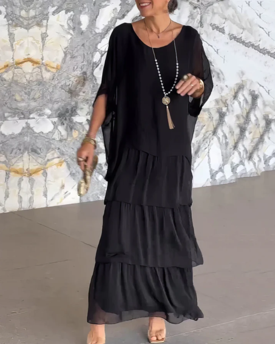 Stylish women's outfit: a boho layered maxi dress set with a relaxed fit batwing top & elegant tiered skirt.