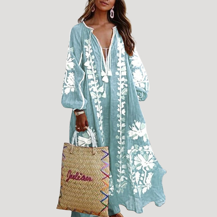 Flowing women's V-neck boho maxi dress, long sleeve, with a comfortable loose fit and vibrant pattern for casual look.