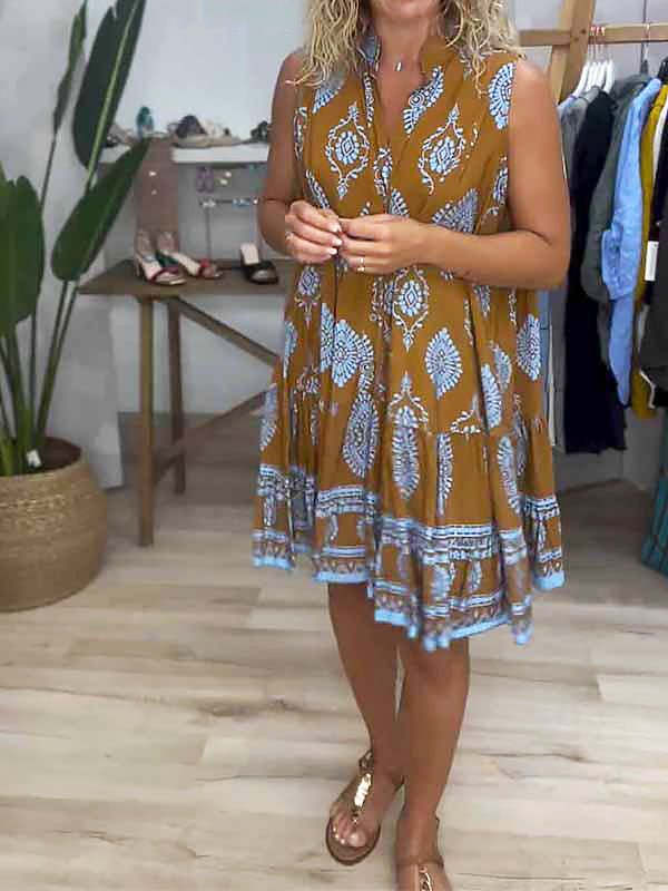 Flowing women's smock dress with a chic paisley medallion print and ruffle hem, a comfortable bohemian mini dress.