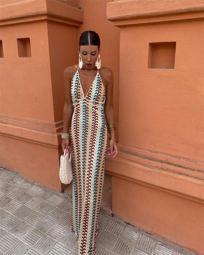 Beige multi boho maxi dress featuring a V-neck, open back, and vibrant print. Ideal for summer parties.