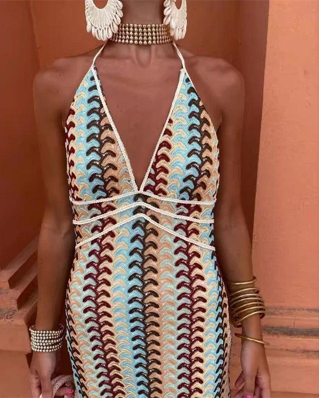 Elegant printed boho V-neck maxi dress for wedding guests. Features a unique beige multi pattern.