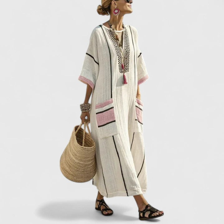 Women's V-neck boho striped maxi dress featuring handy pockets, a loose fit kaftan design. Stylish summer apparel.