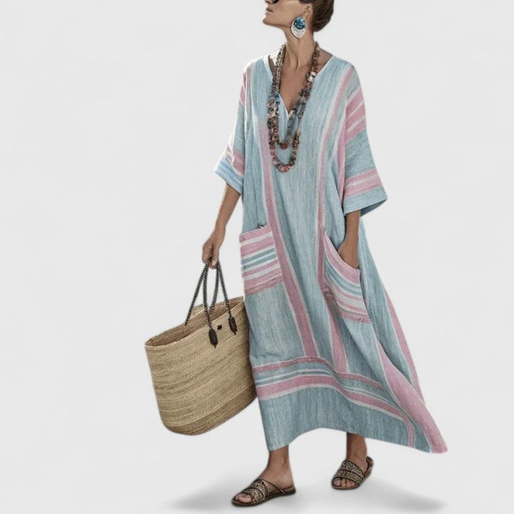 Vacation-ready women's boho striped maxi dress, V-neck, loose fit kaftan with pockets. Comfortable resort wear.