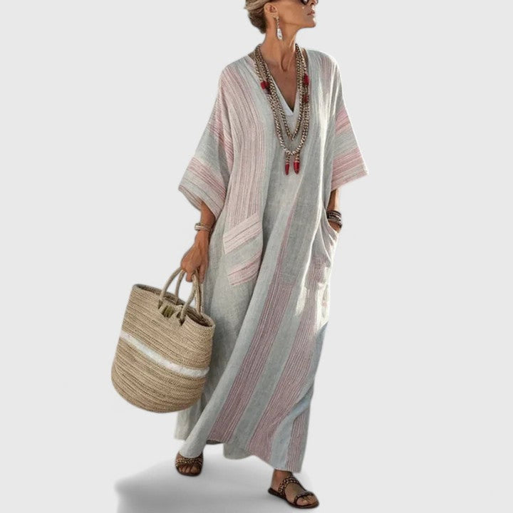 Women's striped boho maxi dress with V-neck, loose fit, and practical pockets. A comfortable kaftan summer dress.