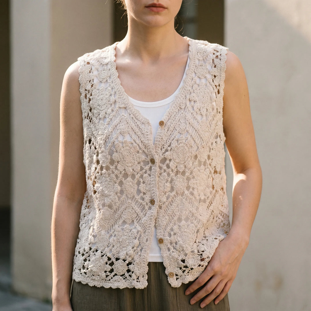 Women's boho summer knit tank top vest with v-neck, sleeveless design, and delicate floral pattern for layering.