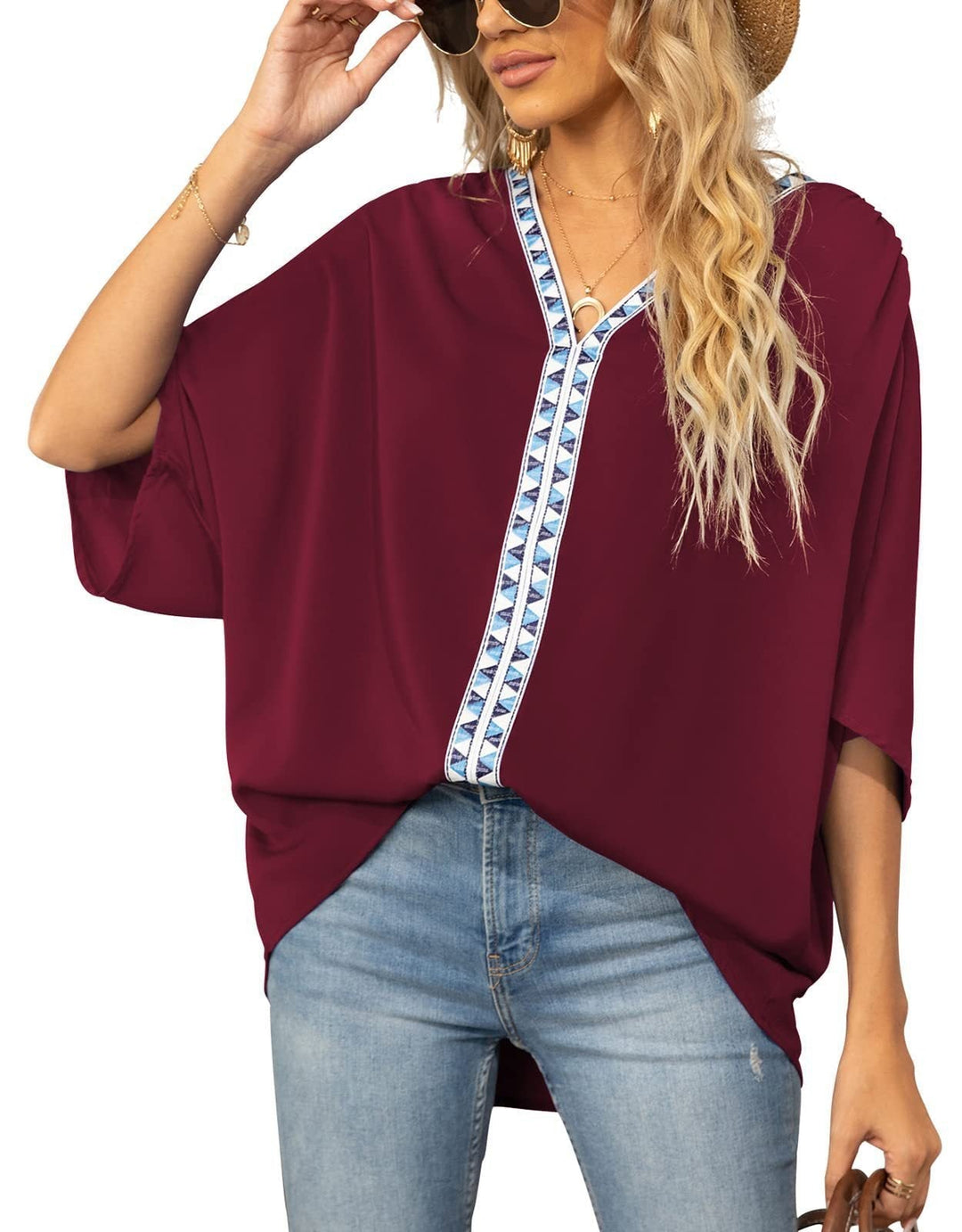 Bohemian style women's blouse, comfortable flowy fit, V-neck, geometric details, perfect for spring.