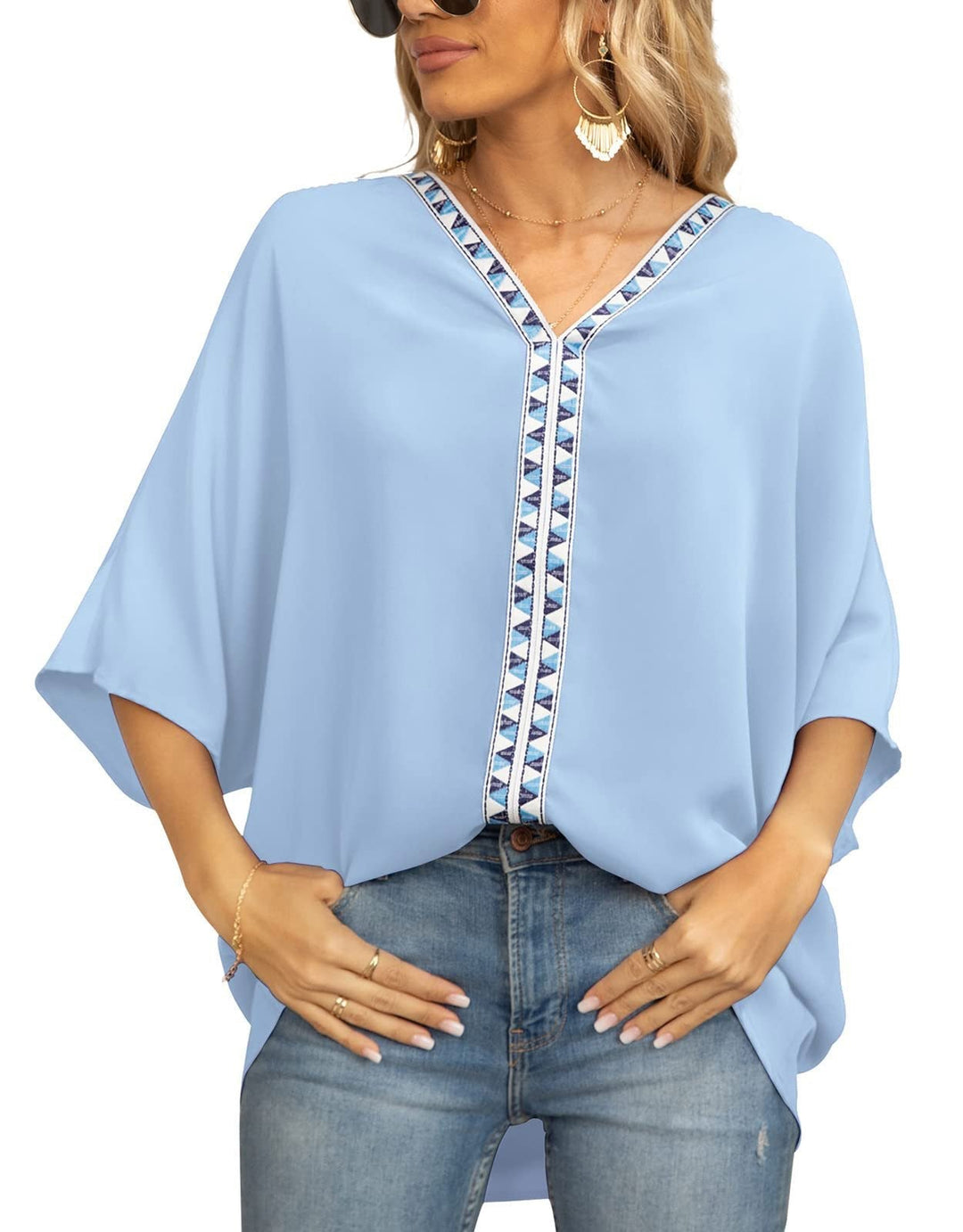 Stylish women's bohemian tunic, geometric V-neck detail, oversized fit, comfortable half-sleeve blouse.