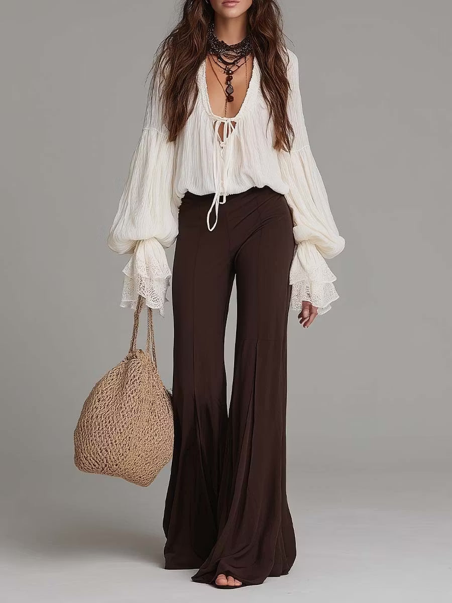 Women's boho two-piece set featuring a lace-up blouse and wide-leg pants, ideal for summer or festival wear.