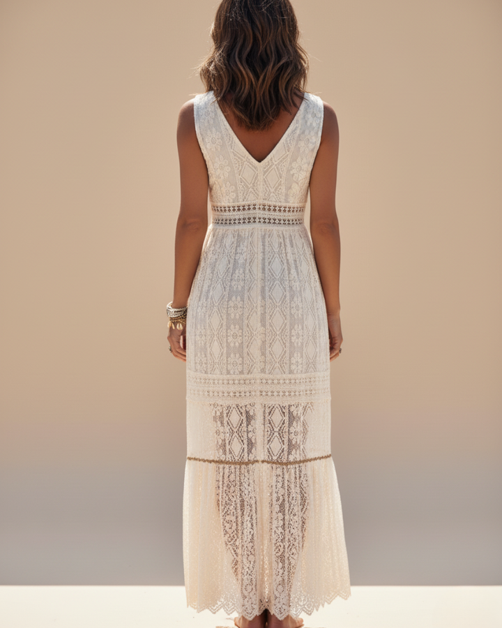 Boho chic women's sleeveless maxi dress with V-neck & tassels. Ideal lightweight vacation, summer, and beach outfit.