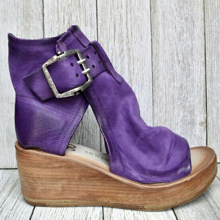 Elegant women's boho wedge sandals featuring secure buckle closure, ideal for stylish summer outfits.