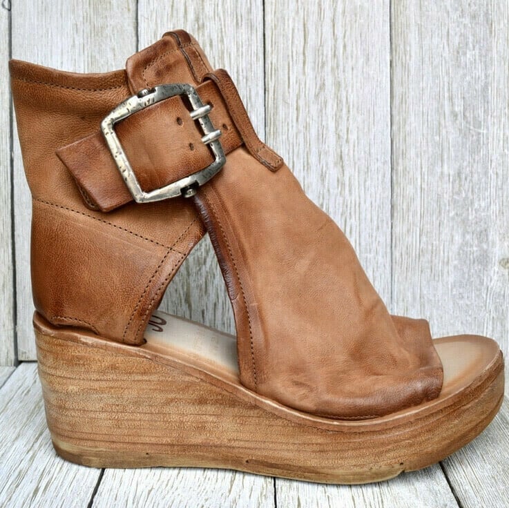 Stylish women's boho wedge sandals with durable buckle, offering comfort & support for summer.