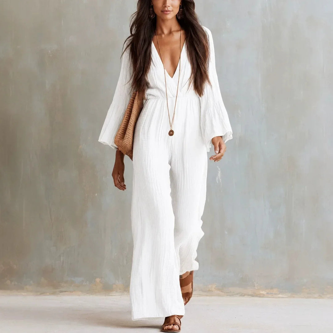 Women's boho wide leg jumpsuit with deep V-neck and flare sleeves, ideal for stylish summer or vacation wear.