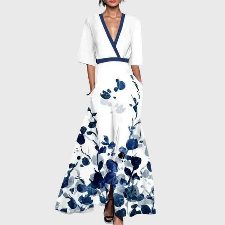 Women's bold floral flowy maxi dress with a flattering V-neck, perfect for summer parties or elegant wedding guests.