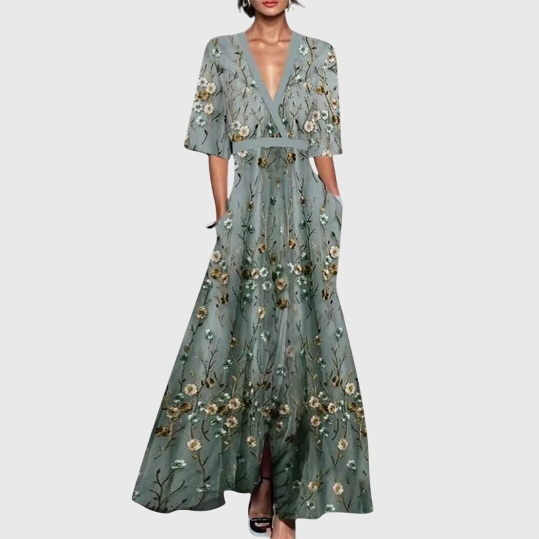 Elegant women's maxi dress featuring a vibrant bold floral print, V-neck, and flowy silhouette for any special occasion.