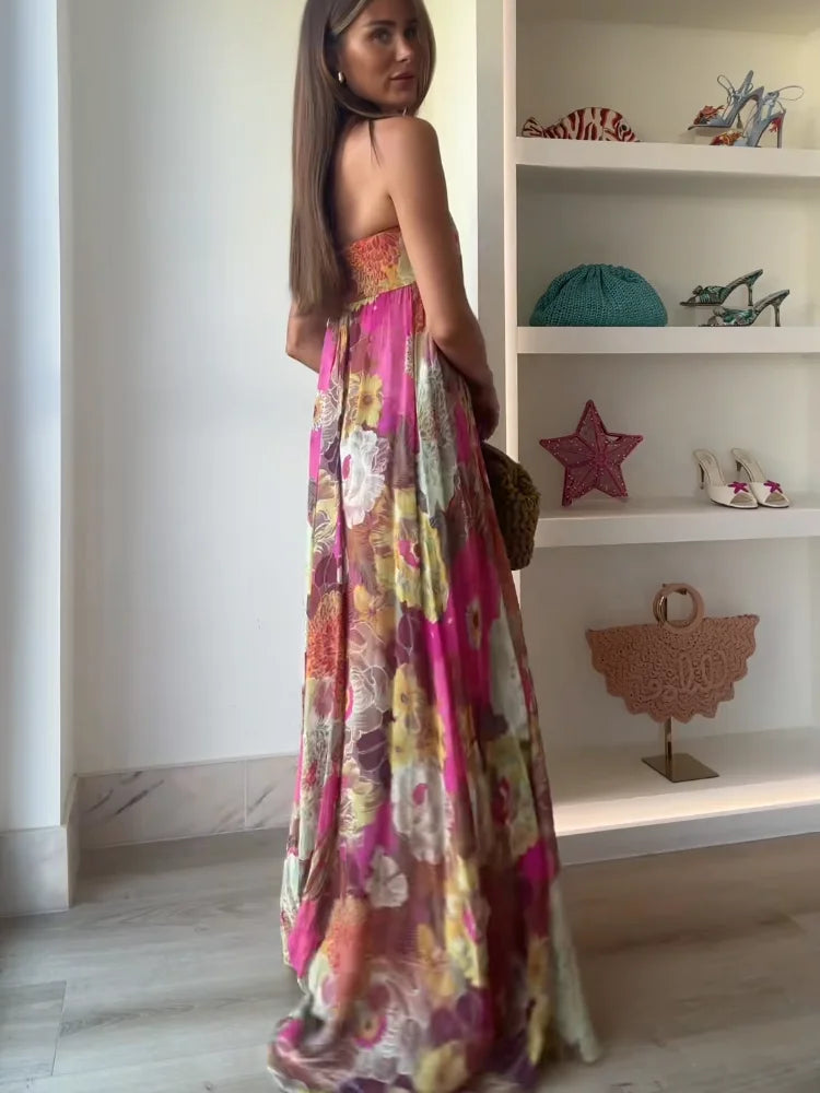 Women's elegant strapless floral maxi dress with bold print, ideal occasion wear & wedding guest attire.