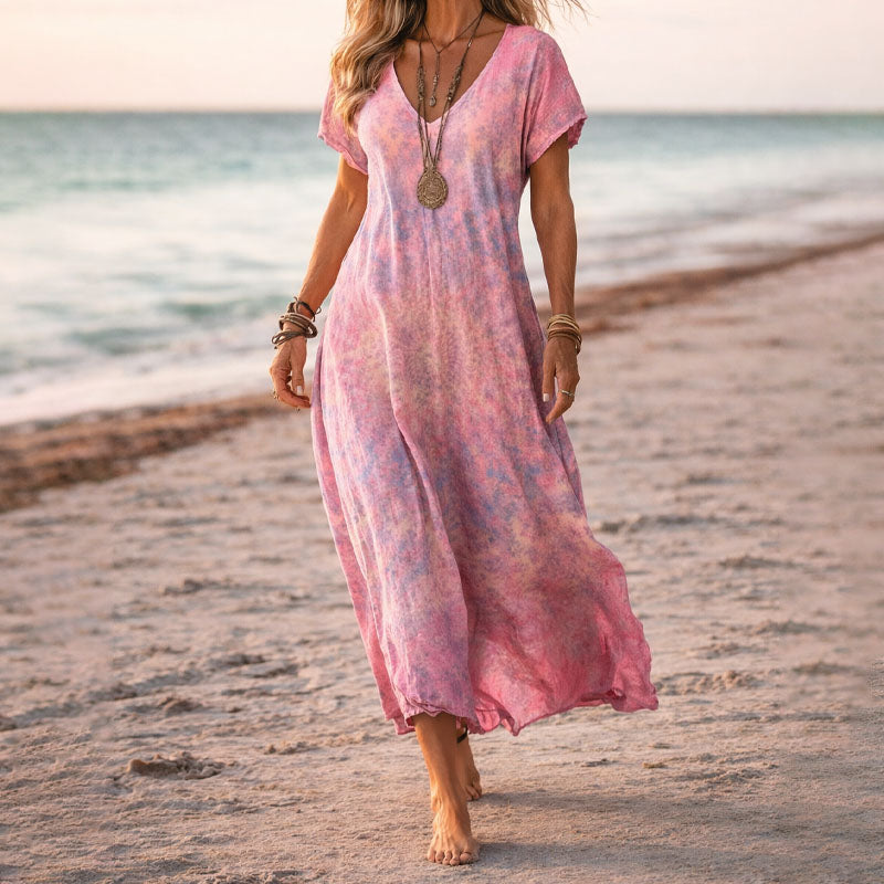 Flowy V-neck women's maxi dress with a vibrant botanical floral print, ideal for elegant boho style.