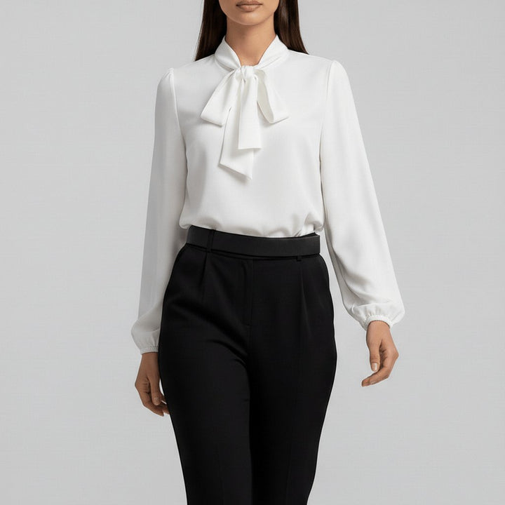Stylish long sleeve blouse for women, featuring a bow tie neck and fashionable puff sleeves.