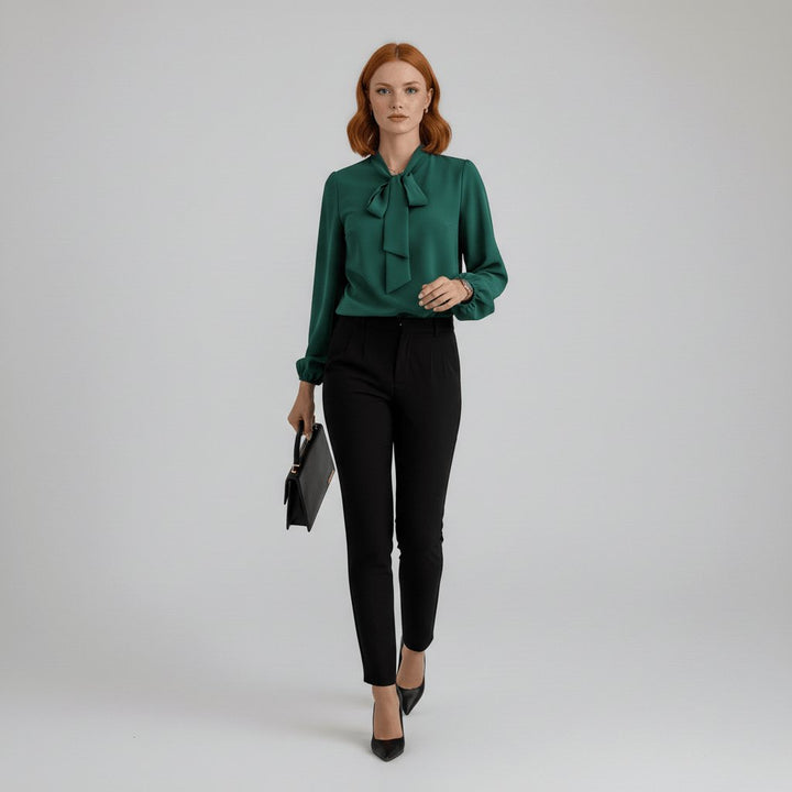 Fashionable long sleeve women's blouse featuring a distinct bow tie neck & trendy puff sleeves.