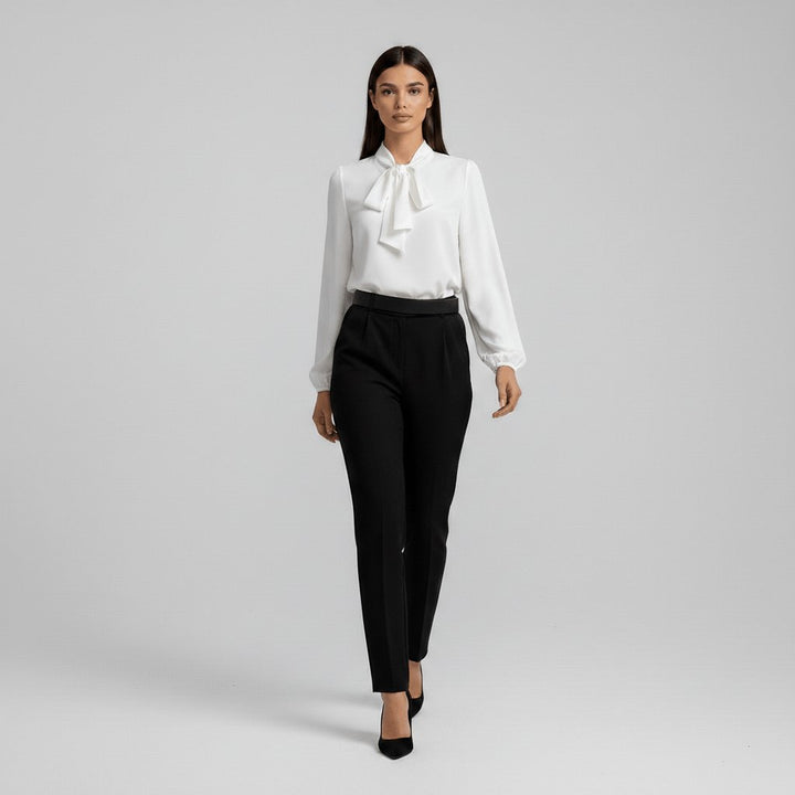 Sophisticated women's formal blouse with a bow tie neck and chic puff sleeves, a fashion statement.