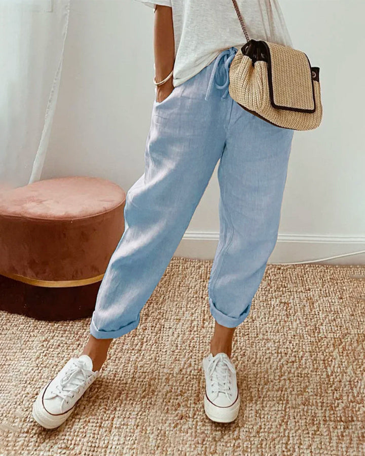 Professional woman wearing moisture-wicking comfort pants, perfect for work or everyday.