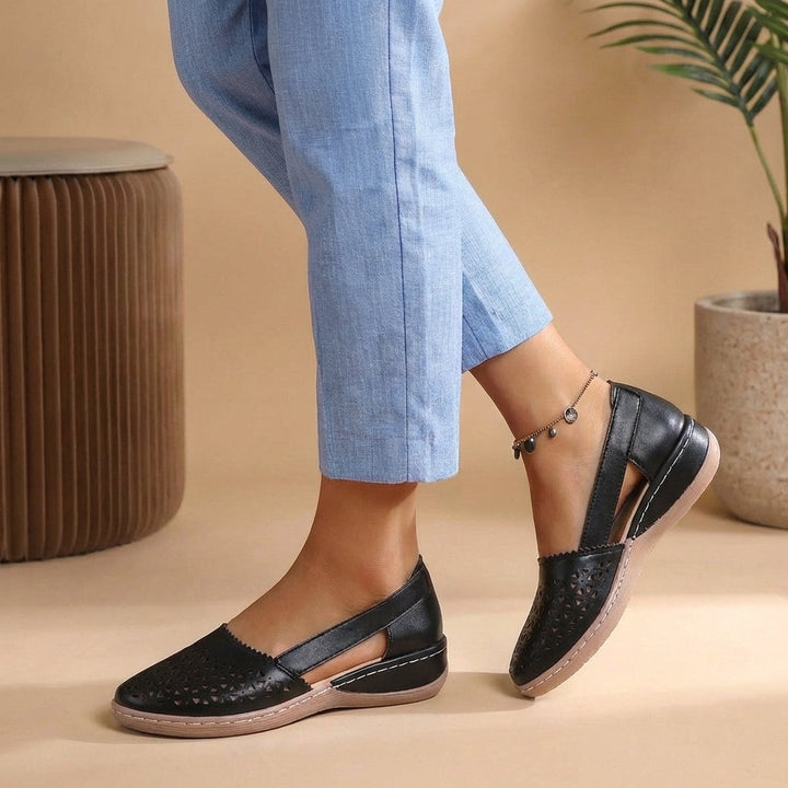 Women's breathable slip-on comfort loafers for daily wear. Ideal casual flats with perforated design.