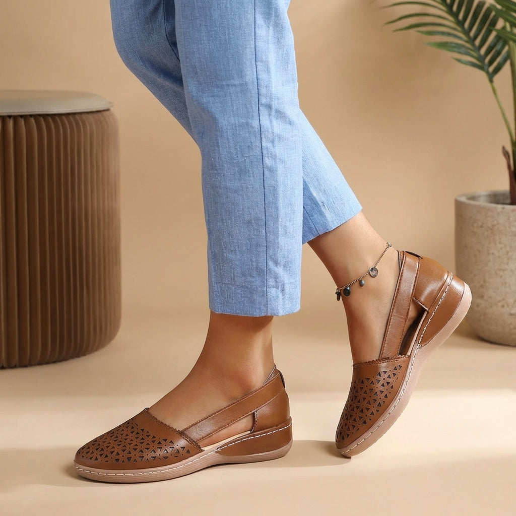 Stylish women's slip-on loafers with perforated design, offering breathability & comfort for spring/summer.