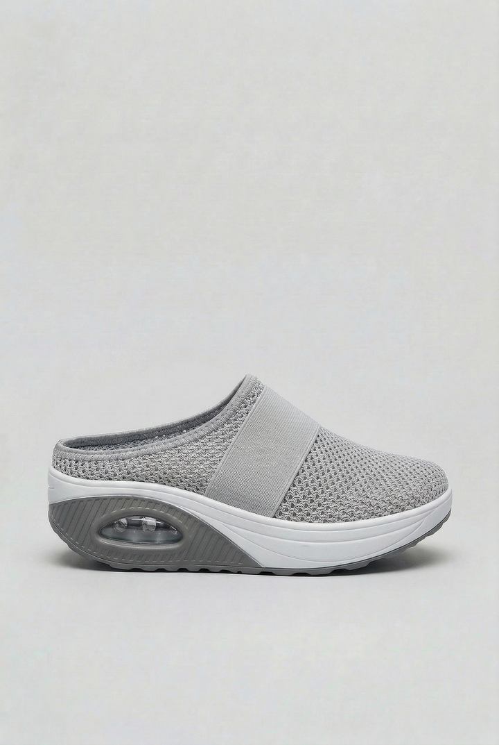 Lightweight women's summer mules, slip-on style with breathable fabric & air cushion sole for all-day comfort.