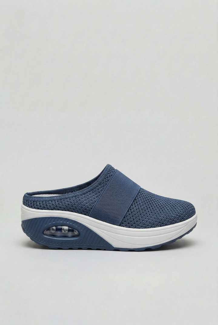 Breathable women's slip-on mules, offering air cushion comfort and an easy-wear open-back design for summer style.