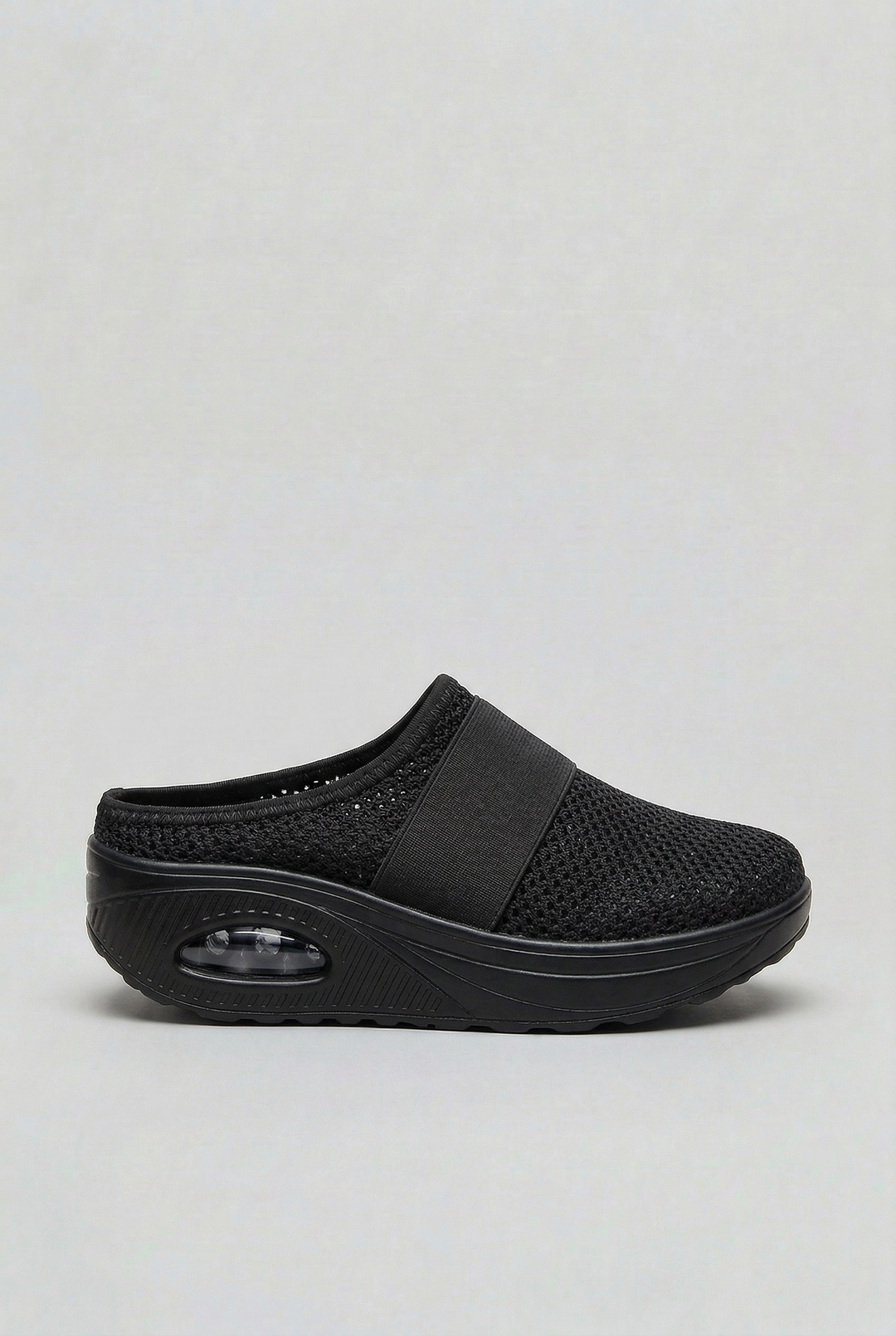 Women's walking mules: breathable slip-on style with a cushioned air sole for lightweight, comfortable everyday wear.