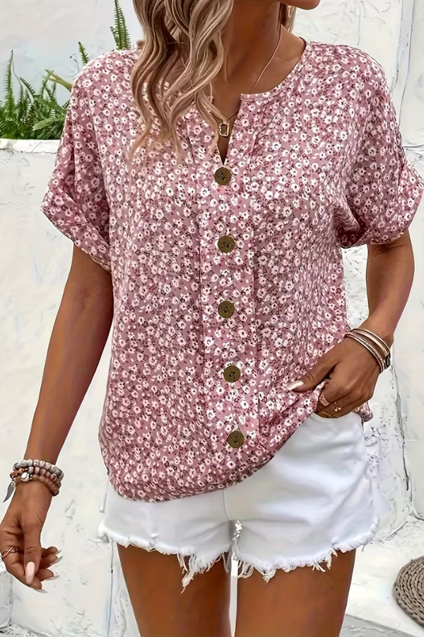 Flowy women's floral summer blouse. Lightweight short-sleeve top, ideal for vacation or casual everyday wear.
