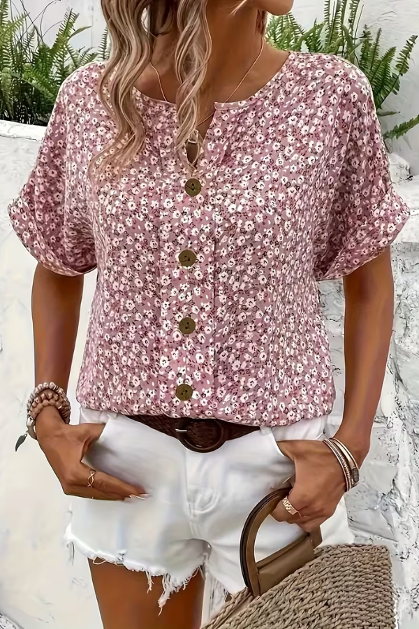 Elegant short-sleeve floral blouse for women. Breezy and lightweight, perfect for spring and summer casual style.