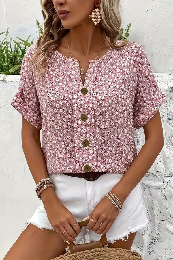 Effortless women's floral summer top. Relaxed fit, lightweight short-sleeve blouse for a breezy, elegant look.