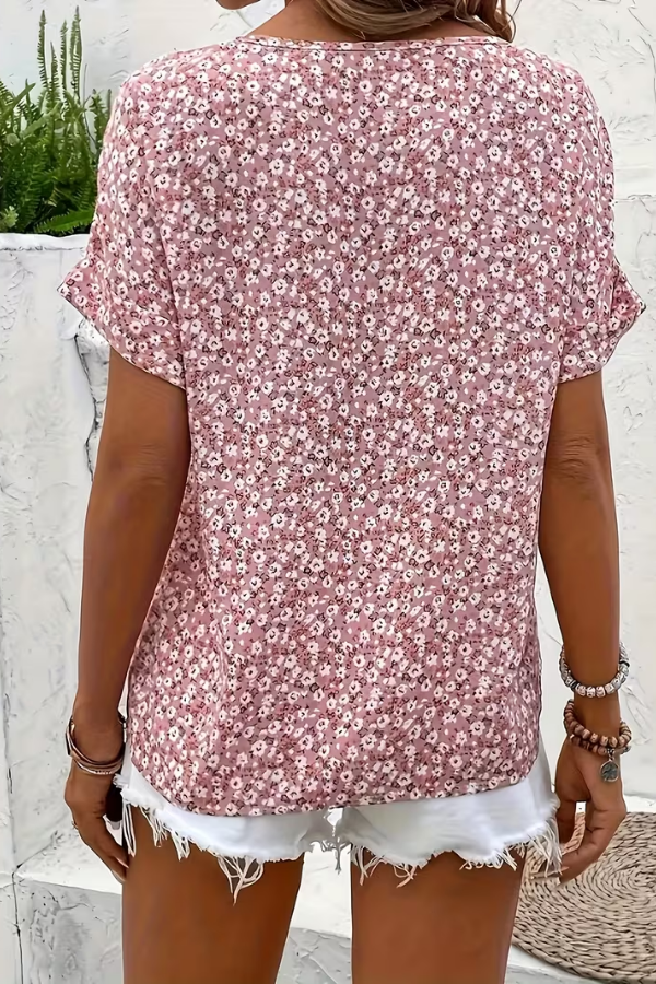 Women's casual floral blouse with short sleeves. Flowy, lightweight, and breezy, offering comfortable summer style.