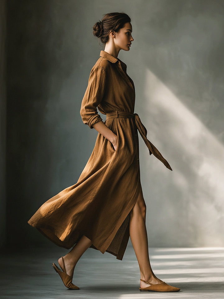 Brown maxi shirt dress for women, featuring a flattering V-neck, long sleeves, and a tie waist. Casual fall essential.