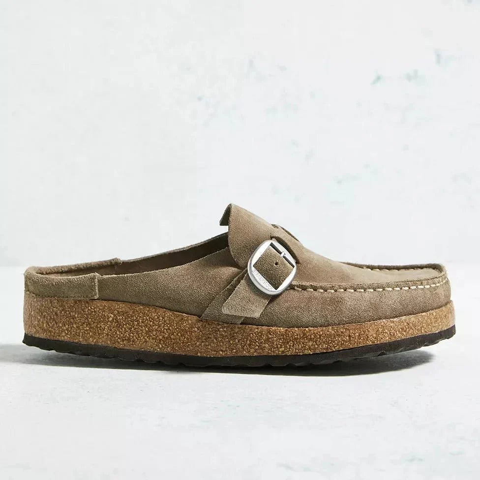 Woman wearing Brynn fashion mules, enjoying easy slip-on comfort and orthopedic support for daily activities.
