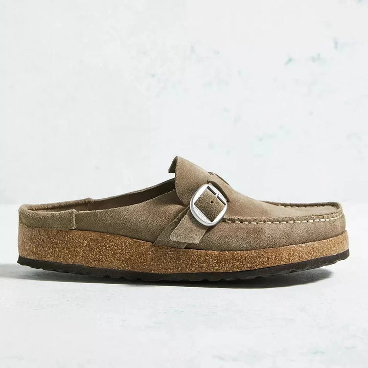 Woman wearing Brynn fashion mules, enjoying easy slip-on comfort and orthopedic support for daily activities.