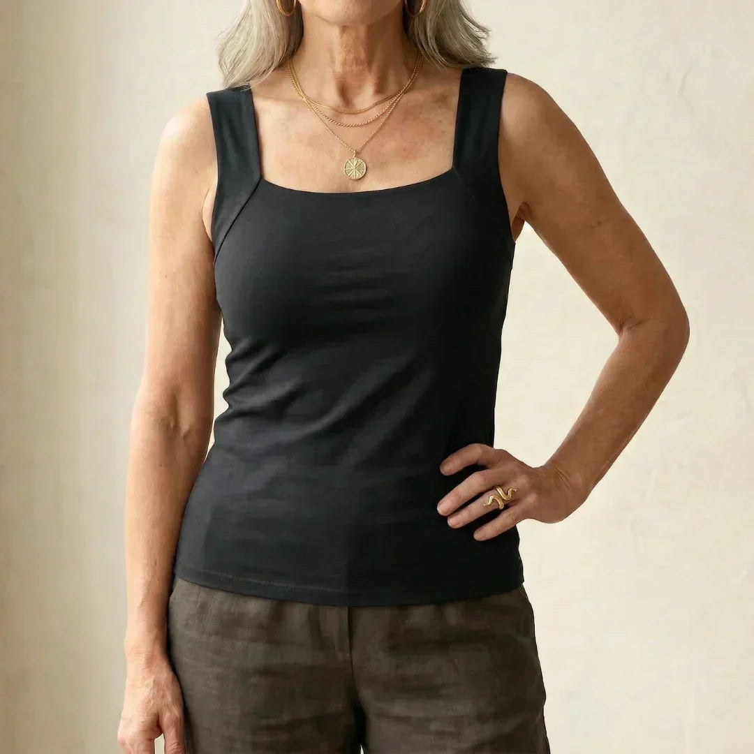 Women's tank with built-in bra for comfortable wire-free support, great for summer styling.